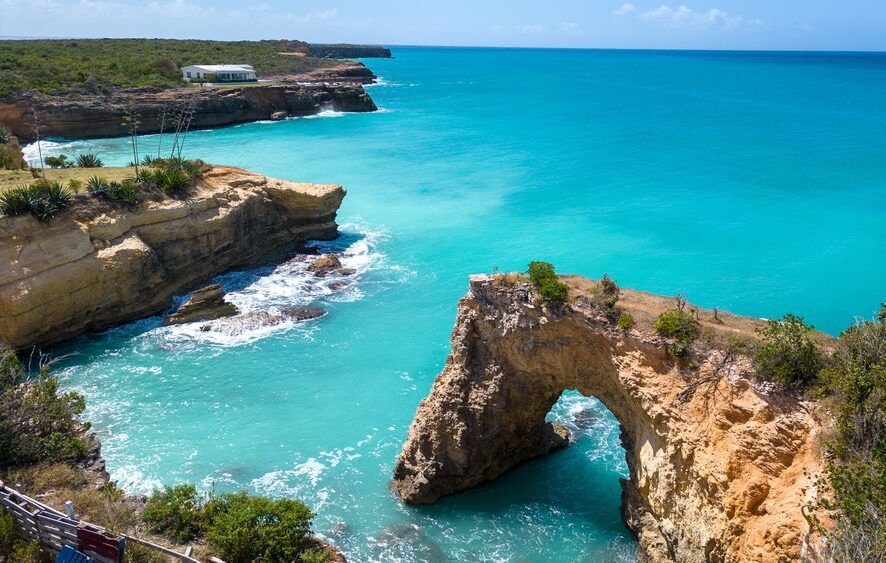 Anguilla,Arch.,Natural,Hole,Carved,In,The,Rock.,Turquoise,Sea